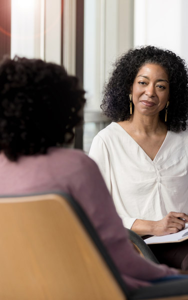 Woman therapist listens to patient